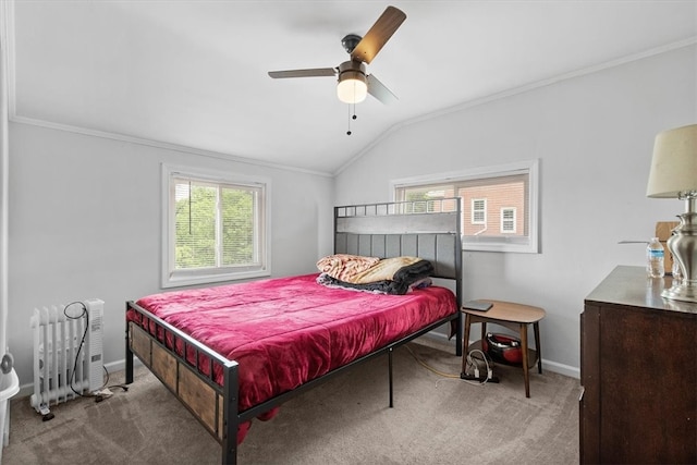 bedroom featuring ceiling fan, vaulted ceiling, ornamental molding, and radiator