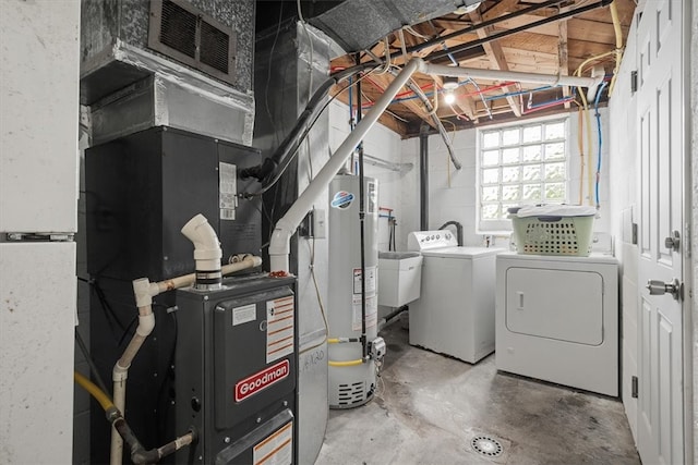 basement featuring independent washer and dryer and gas water heater