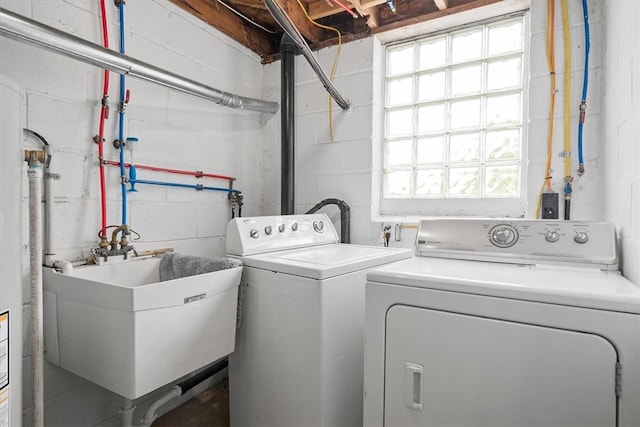 laundry room featuring washer and dryer and sink