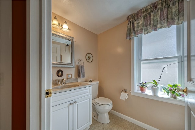 bathroom featuring large vanity and toilet