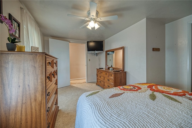 bedroom with light carpet and ceiling fan