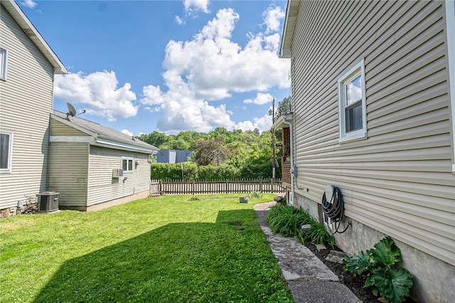 view of yard with central AC unit