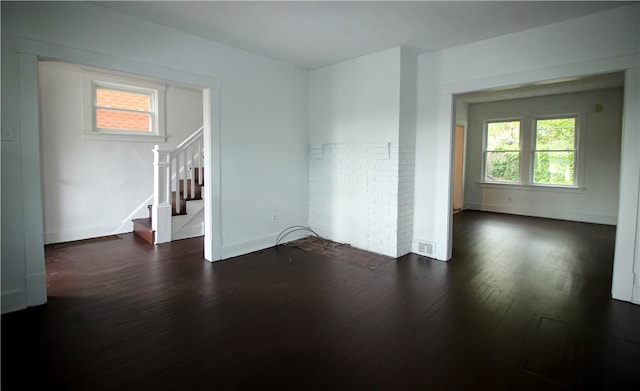 spare room featuring dark hardwood / wood-style flooring