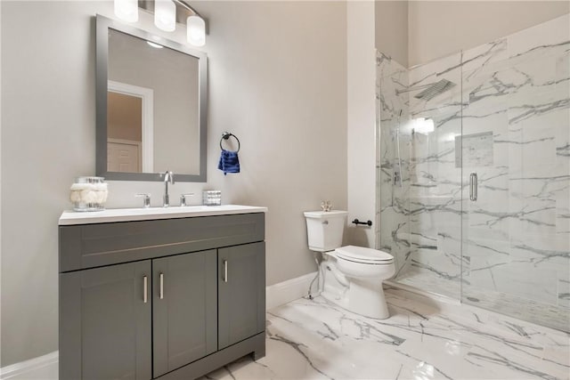 bathroom with vanity, an enclosed shower, and toilet