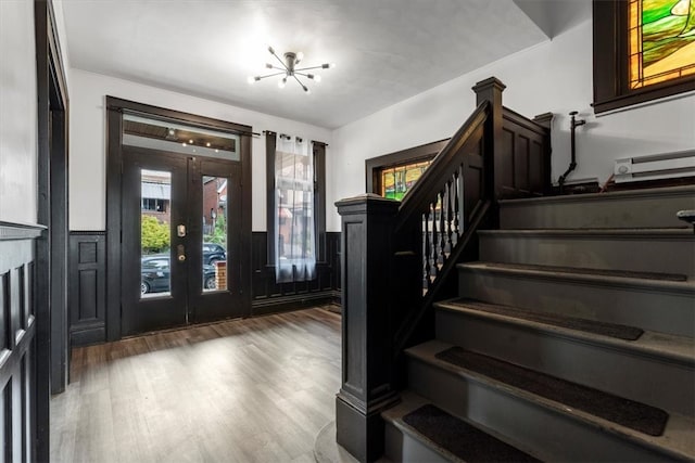 entrance foyer featuring hardwood / wood-style floors and french doors