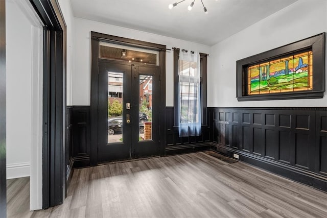 foyer featuring french doors and hardwood / wood-style flooring