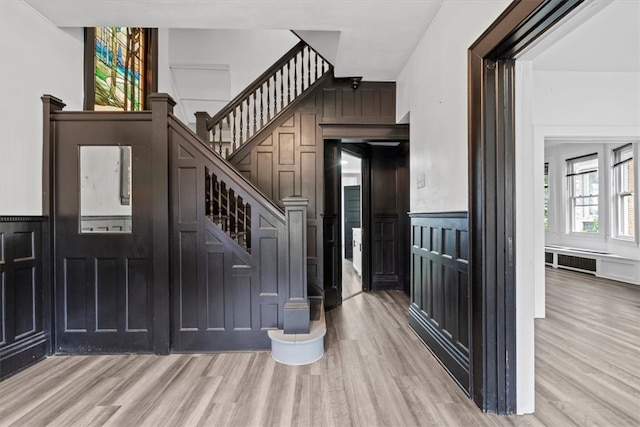 entryway with light hardwood / wood-style flooring