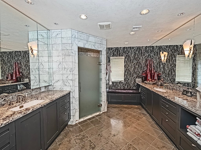 bathroom featuring vanity with extensive cabinet space, an enclosed shower, tile walls, and tile floors