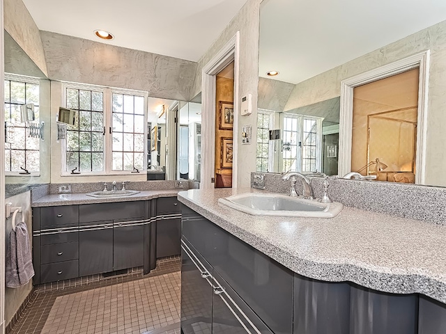 bathroom featuring tile floors, a wealth of natural light, and vanity