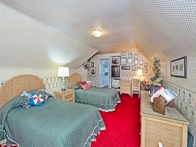 carpeted bedroom featuring lofted ceiling