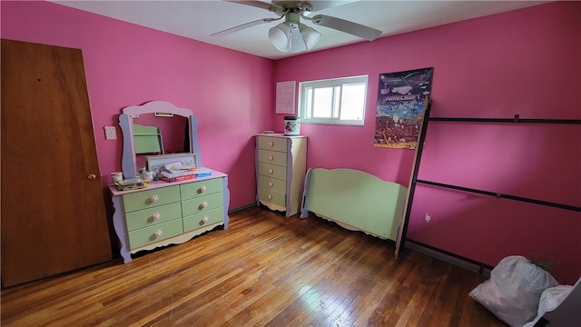 bedroom featuring ceiling fan and hardwood / wood-style flooring