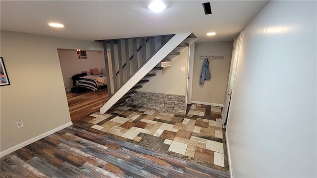 basement featuring dark tile floors