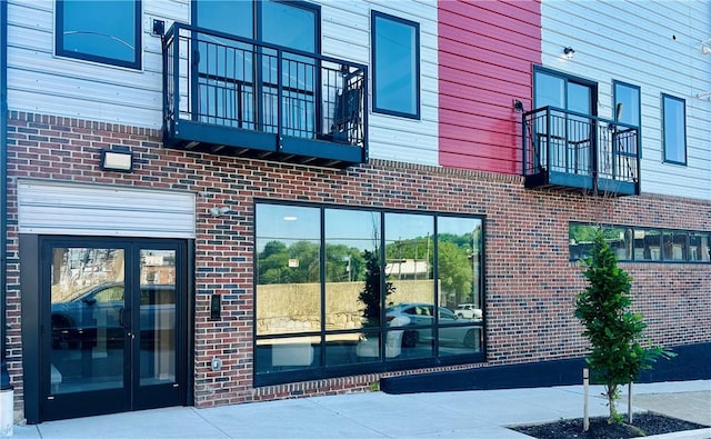 doorway to property with a balcony