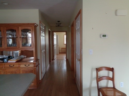 hall with dark hardwood / wood-style flooring