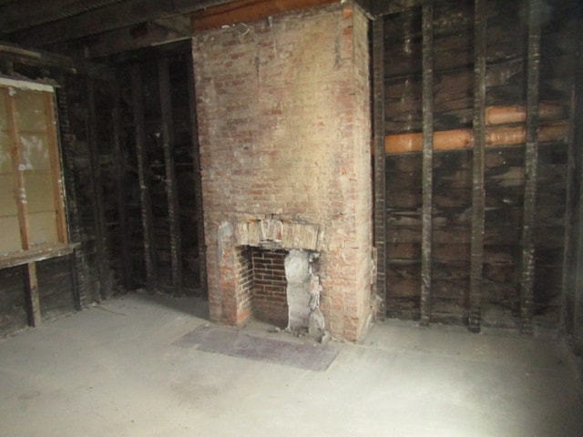 basement with brick wall