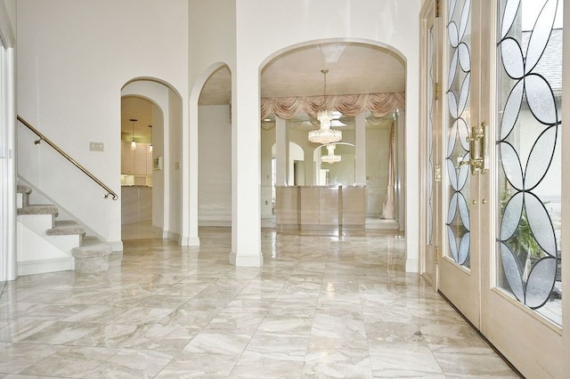 entryway featuring a notable chandelier