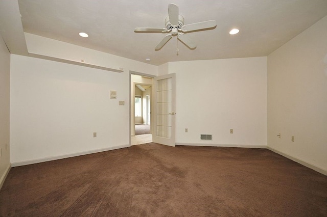 carpeted empty room featuring ceiling fan