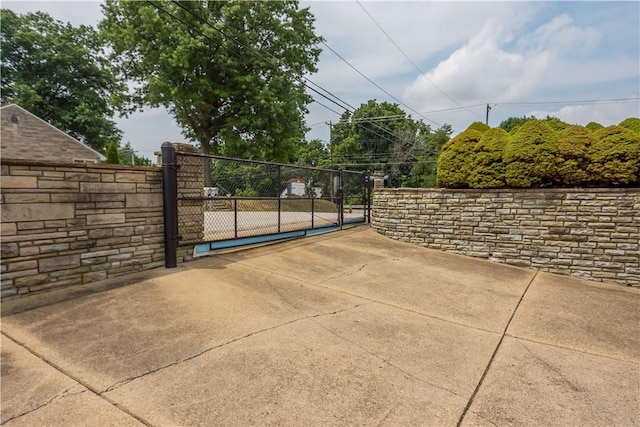 view of gate featuring fence