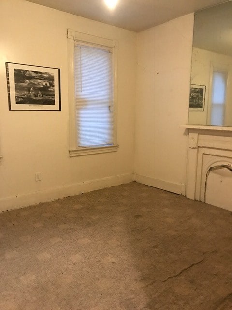 empty room featuring carpet flooring