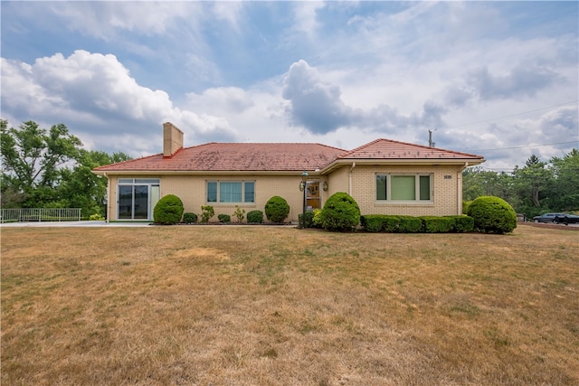 view of front of home with a front yard