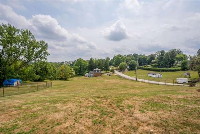 view of yard with a rural view