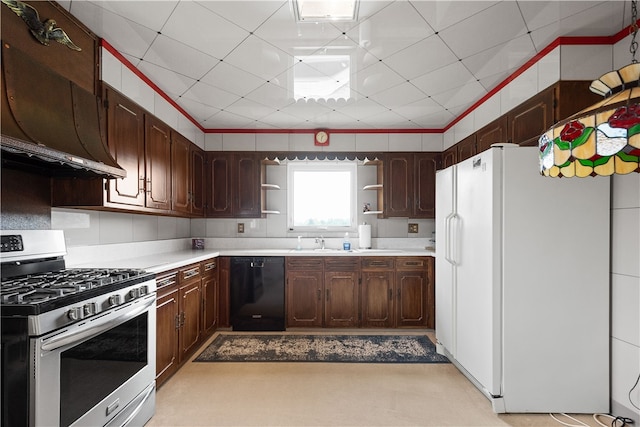 kitchen featuring black dishwasher, dark brown cabinets, white refrigerator, and stainless steel gas range