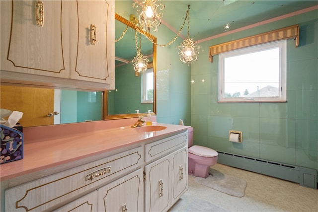 bathroom with tile patterned flooring, crown molding, toilet, vanity, and a baseboard radiator