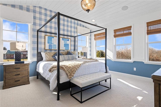 carpeted bedroom featuring multiple windows