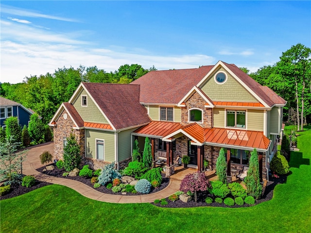 craftsman-style house with a front yard