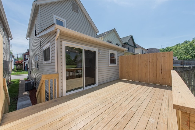 wooden terrace featuring central AC unit