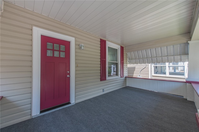 property entrance featuring covered porch