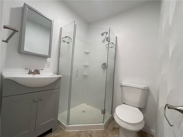 bathroom featuring vanity, toilet, walk in shower, and tile patterned floors