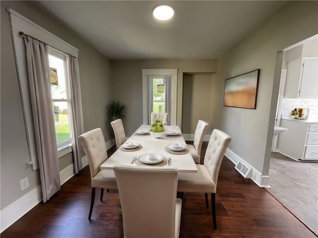 dining room with dark wood-type flooring