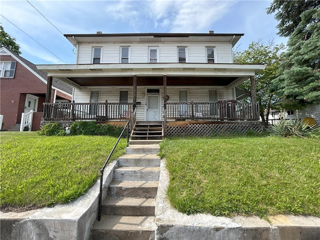 view of front facade with a front lawn and covered porch