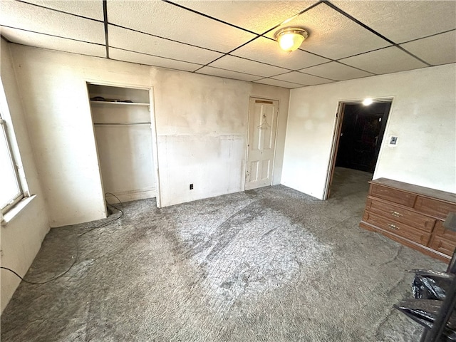 unfurnished bedroom with a paneled ceiling