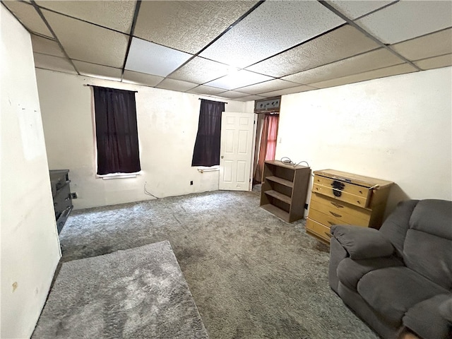 interior space with carpet flooring and a paneled ceiling