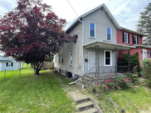 view of front of house featuring a front lawn and a porch