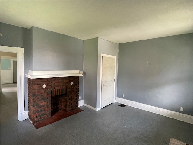 unfurnished living room featuring a fireplace