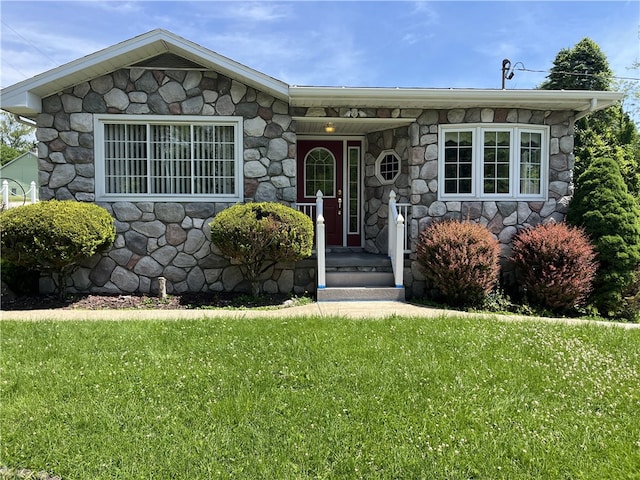 property entrance with a lawn