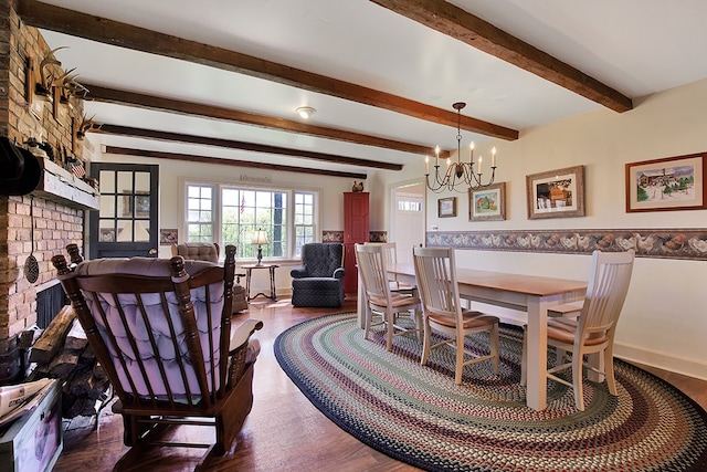 dining space with beamed ceiling, a chandelier, a fireplace, and wood-type flooring