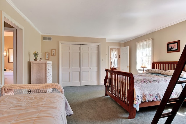 carpeted bedroom with ornamental molding, a closet, and connected bathroom