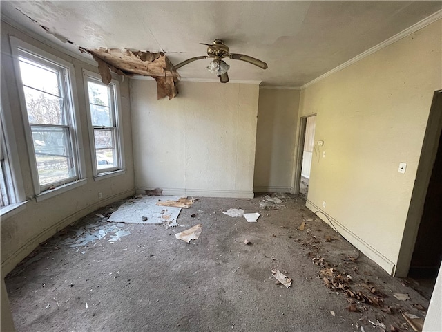 unfurnished room with ornamental molding and ceiling fan