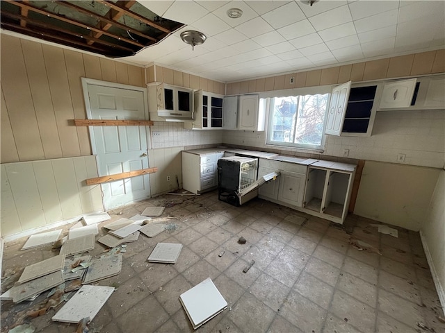 kitchen featuring white cabinetry and light tile floors