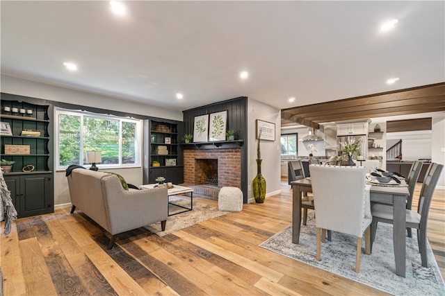 interior space with a healthy amount of sunlight, light wood-type flooring, and a fireplace