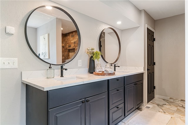 bathroom featuring double sink vanity and tile floors