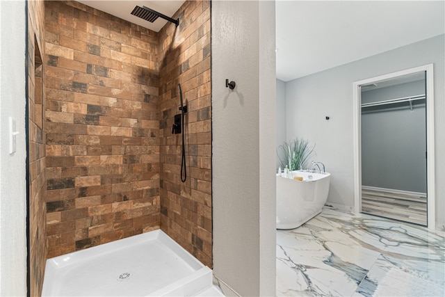 bathroom with tile flooring and plus walk in shower