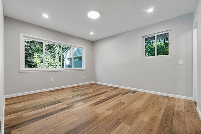 spare room with light hardwood / wood-style floors