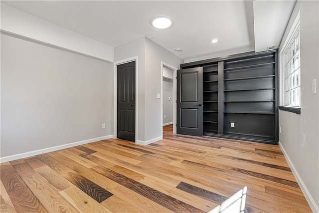 unfurnished bedroom with light hardwood / wood-style flooring