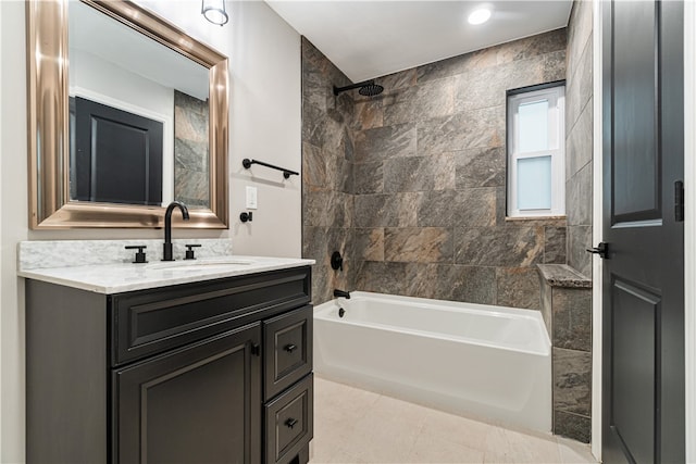 bathroom featuring tile floors, tiled shower / bath, and large vanity