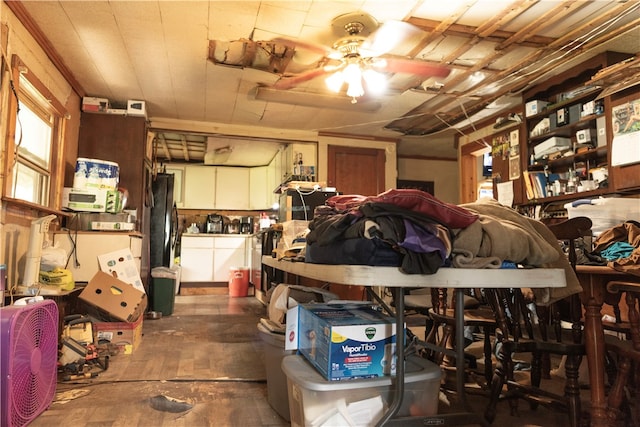 garage featuring black refrigerator and ceiling fan